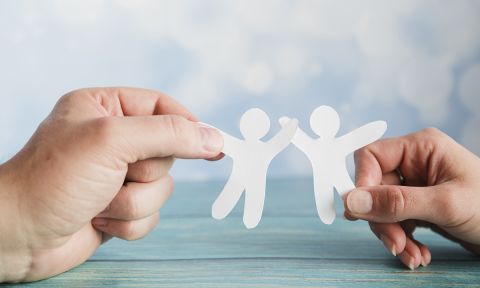 hands holding paper friends (decorative) 